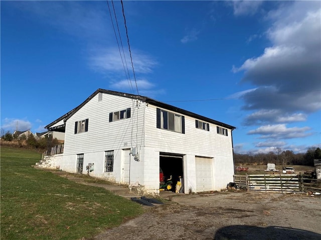 back of property with a garage