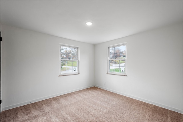 spare room with carpet floors and a healthy amount of sunlight