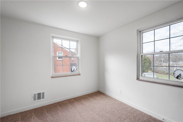 empty room with carpet flooring