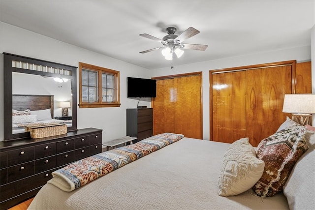 bedroom featuring multiple closets and ceiling fan