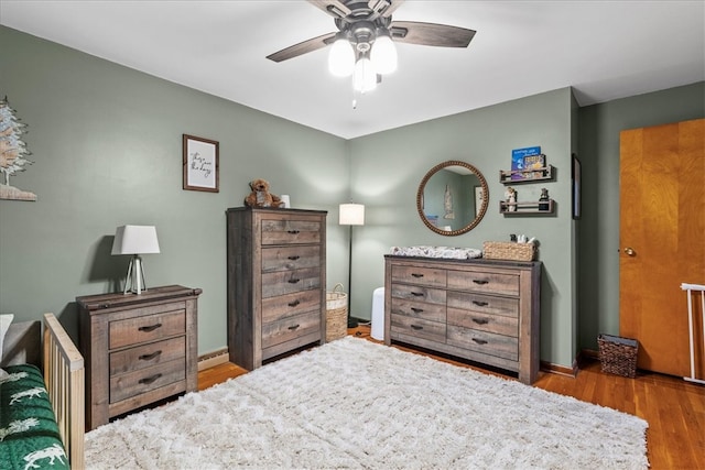 bedroom featuring wood-type flooring and ceiling fan