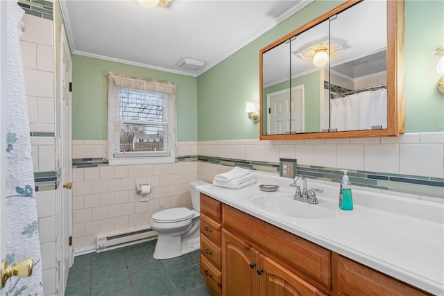 bathroom with tile patterned floors, vanity, crown molding, a baseboard radiator, and tile walls