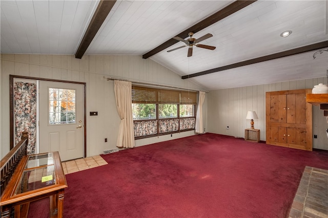 living room with vaulted ceiling with beams, ceiling fan, and carpet floors