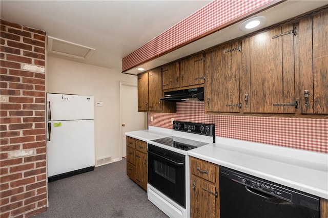 kitchen with decorative backsplash, dark carpet, white appliances, and extractor fan