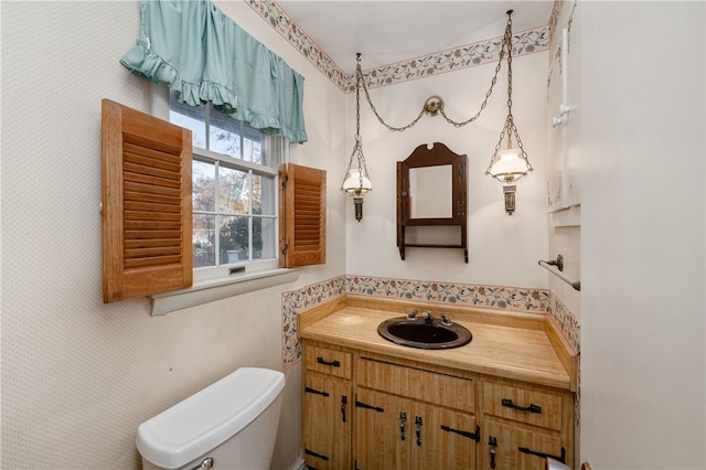 bathroom with vanity and toilet