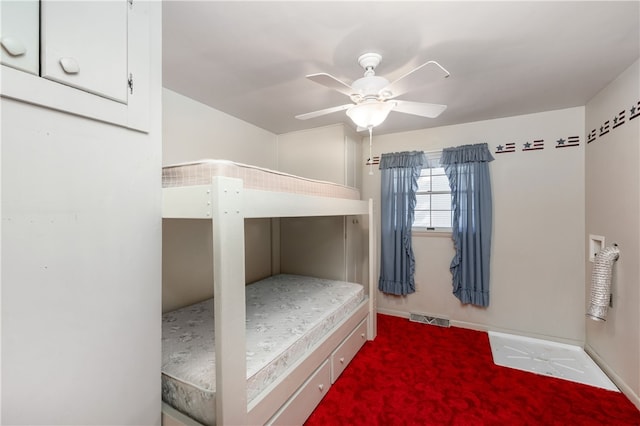 unfurnished bedroom featuring carpet flooring and ceiling fan