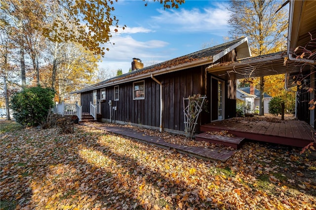 view of property exterior featuring a deck