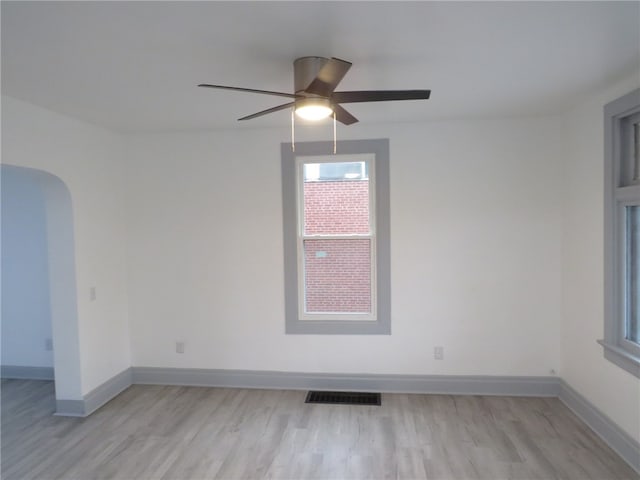 spare room featuring ceiling fan and light hardwood / wood-style floors