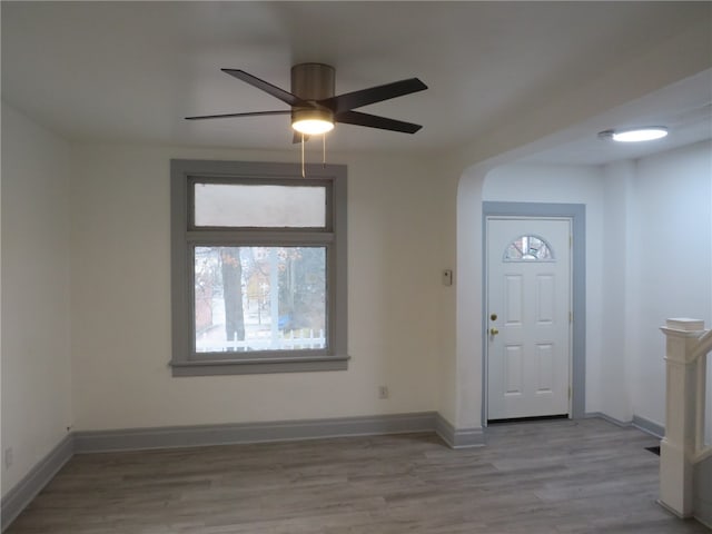 entrance foyer with ceiling fan and light hardwood / wood-style flooring