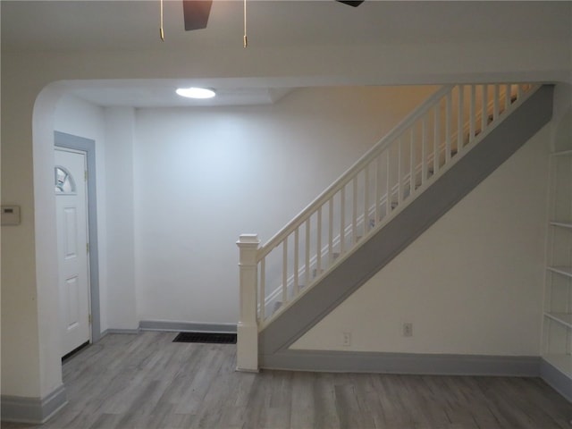 staircase featuring hardwood / wood-style floors