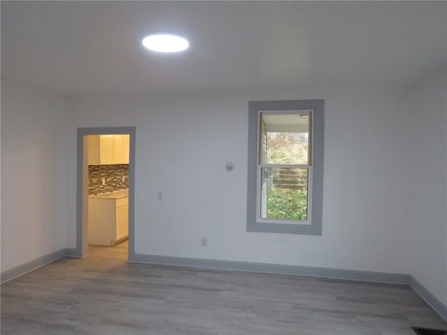 unfurnished room featuring light hardwood / wood-style flooring