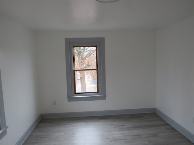 unfurnished room featuring light wood-type flooring