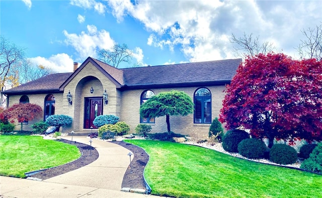 view of front of home with a front lawn