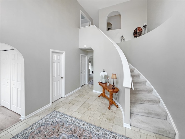 entryway with a high ceiling