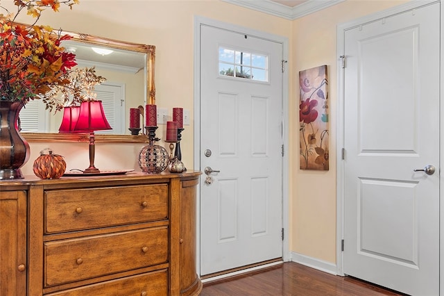 entrance foyer featuring crown molding and dark wood-type flooring