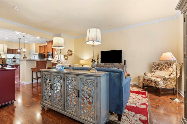 living room featuring dark wood-type flooring and ornamental molding