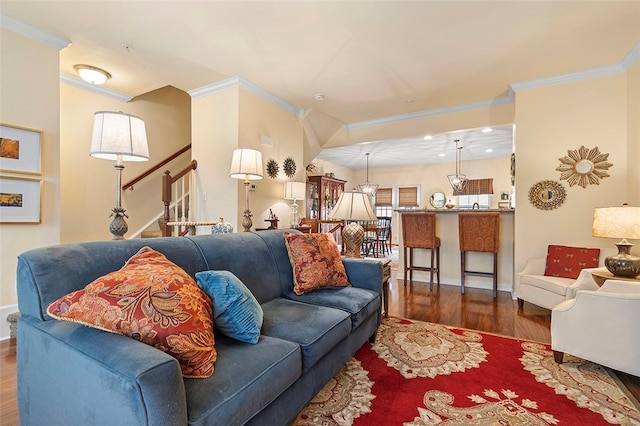 living room featuring dark hardwood / wood-style floors and crown molding