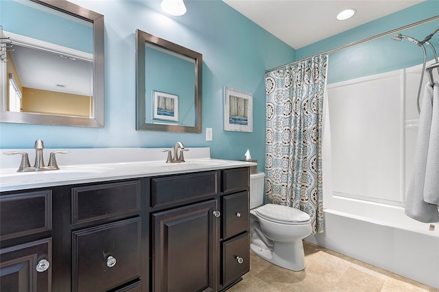 full bathroom with tile patterned flooring, shower / bath combo with shower curtain, vanity, and toilet