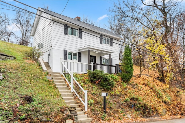 front of property featuring covered porch