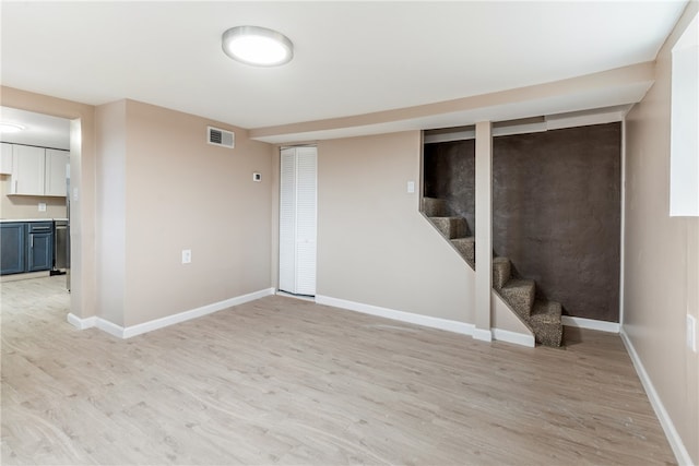 basement with light wood-type flooring