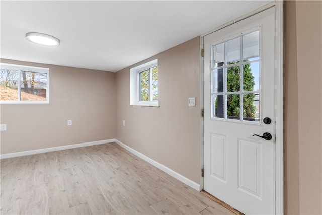 doorway to outside with light wood-type flooring