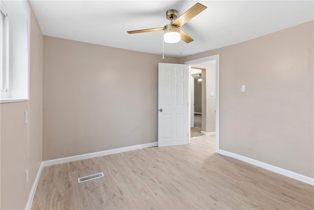 spare room with light hardwood / wood-style floors and ceiling fan