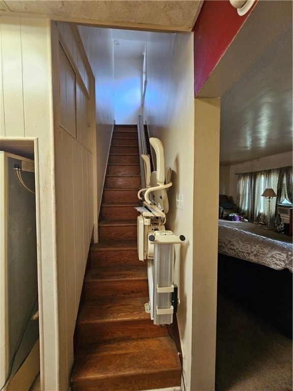 stairway with hardwood / wood-style floors