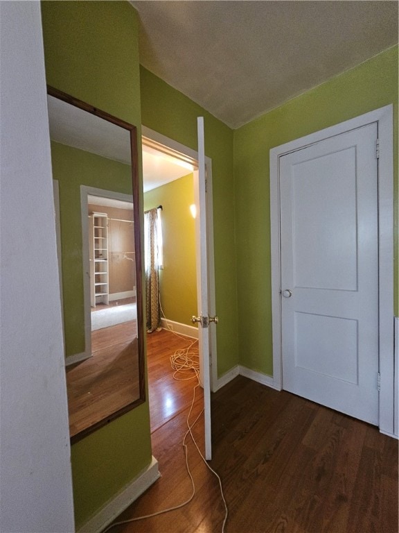 interior space featuring wood-type flooring and a textured ceiling