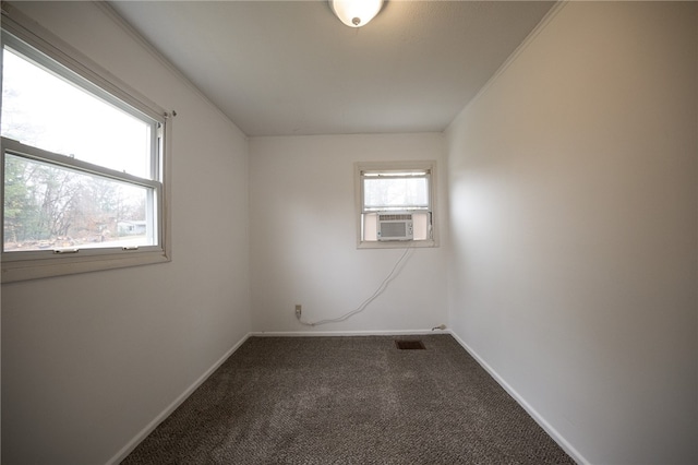 unfurnished room with carpet, cooling unit, and crown molding