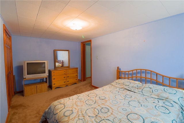 bedroom featuring light colored carpet