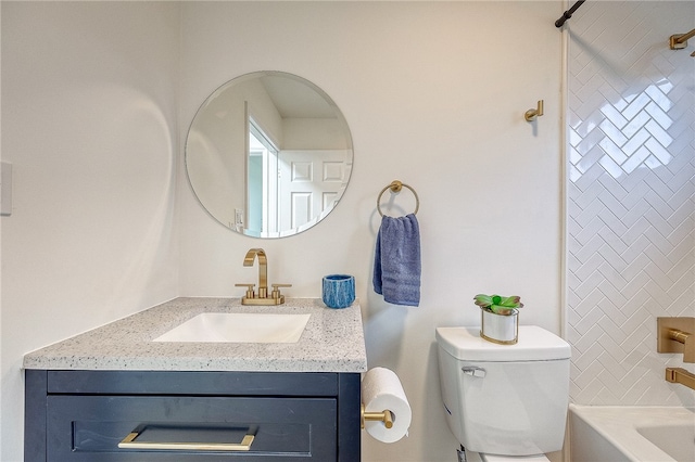 bathroom with toilet and vanity