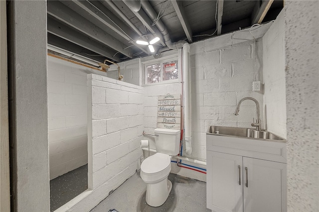 bathroom featuring toilet and vanity