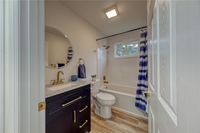 full bathroom featuring toilet, vanity, wood-type flooring, and shower / tub combo with curtain