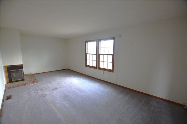 unfurnished living room with carpet flooring