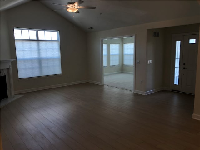 unfurnished living room featuring ceiling fan, wood-type flooring, a high end fireplace, and vaulted ceiling