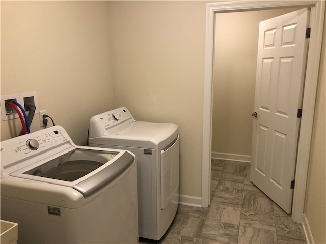 laundry room with washer and clothes dryer