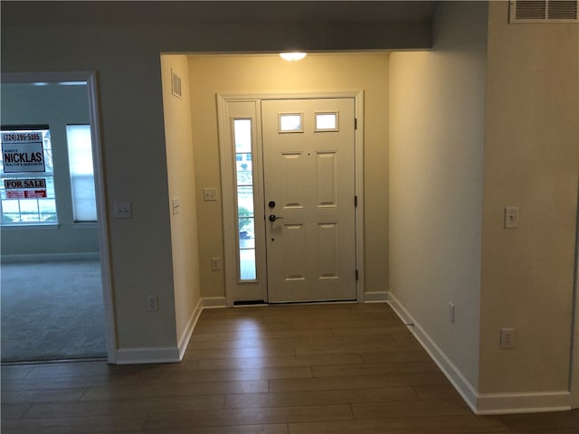 foyer entrance with dark wood-type flooring