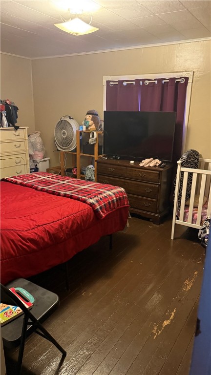 bedroom with hardwood / wood-style flooring