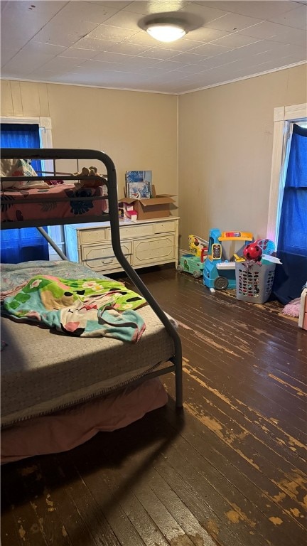 bedroom with hardwood / wood-style flooring