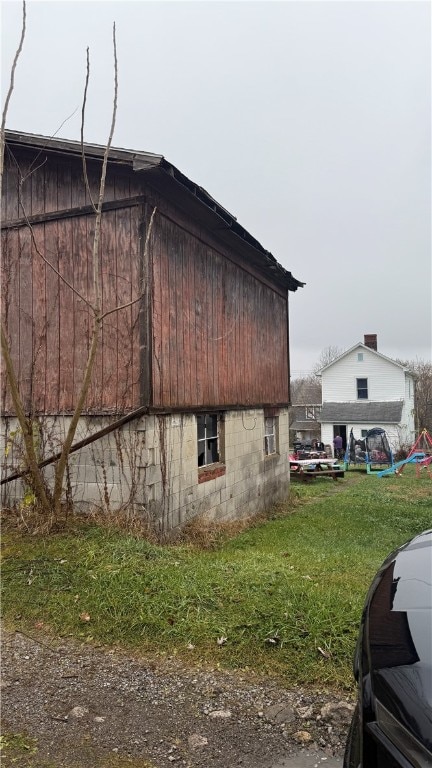 view of home's exterior with a yard