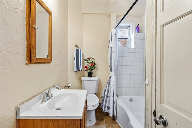 full bathroom featuring tile patterned floors, vanity, toilet, and tiled shower / bath