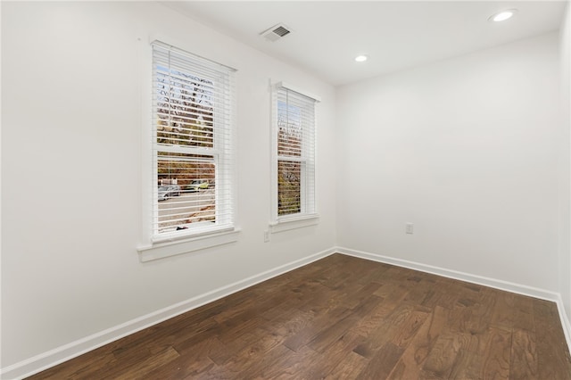 empty room featuring dark hardwood / wood-style floors