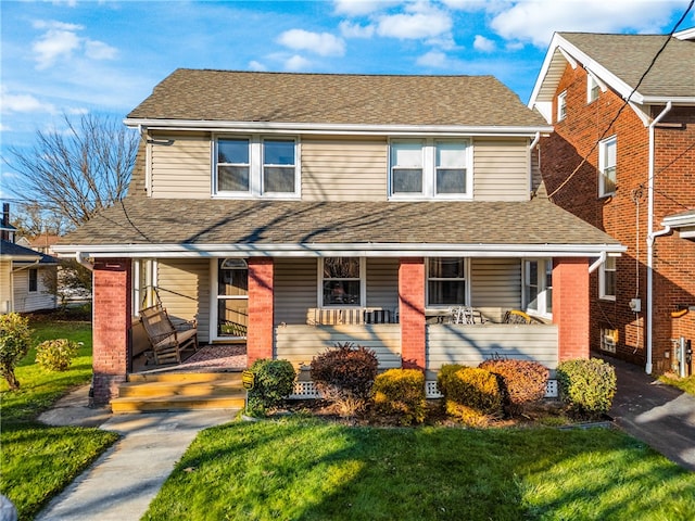 view of front of home featuring a porch and a front yard