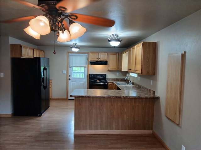 kitchen featuring ceiling fan, sink, kitchen peninsula, light hardwood / wood-style floors, and black appliances