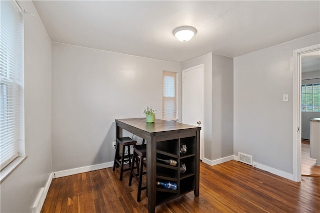 dining room featuring dark wood-type flooring