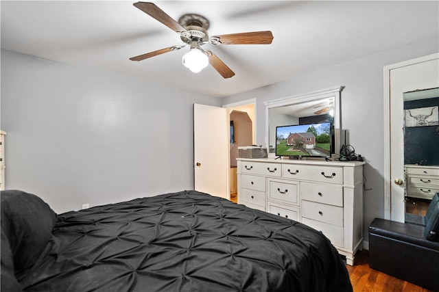 bedroom with ceiling fan and dark wood-type flooring