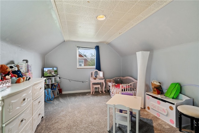 playroom with carpet floors and vaulted ceiling