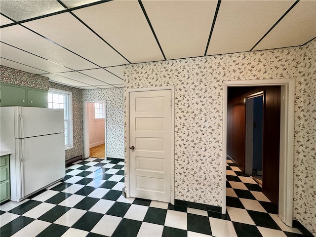 interior space featuring a paneled ceiling