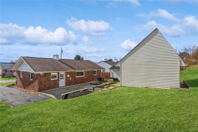 view of property exterior featuring a yard and a patio