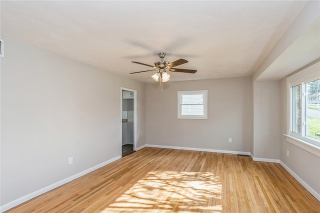 spare room with ceiling fan and light hardwood / wood-style floors